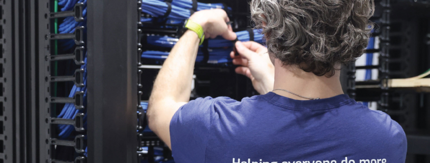 Man working on wires at Data Center